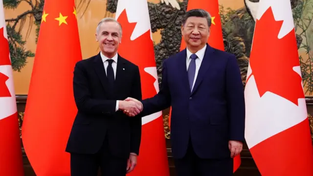 Carney dhe Xi shtrëngojnë duart